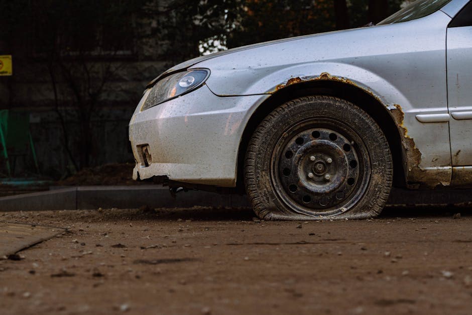Close-up of a vehicle with a flat tire, illustrating flat tire safety near Grantville PA.