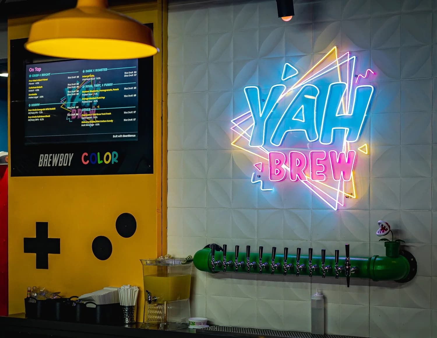 Neon 'YAH BREW' sign and a green Super Mario warp-pipe tap line at Yah Brew Taproom in Hershey, PA