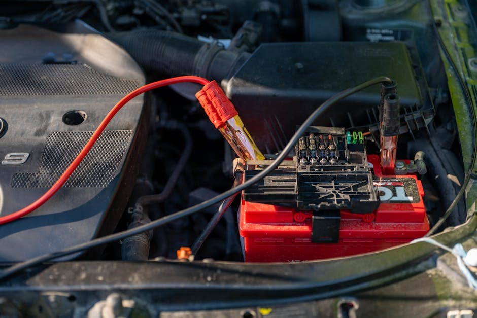 Close-up of a car battery in an engine bay for winter battery testing in Grantville PA.